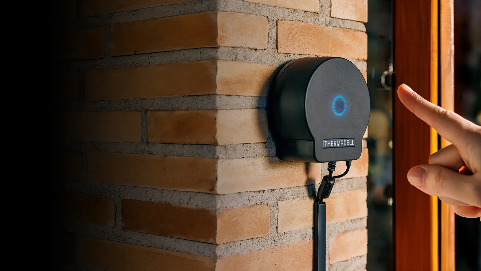 Pressing the button on the Thermacell LIV 2.0 hub for on-demand mosquito protection